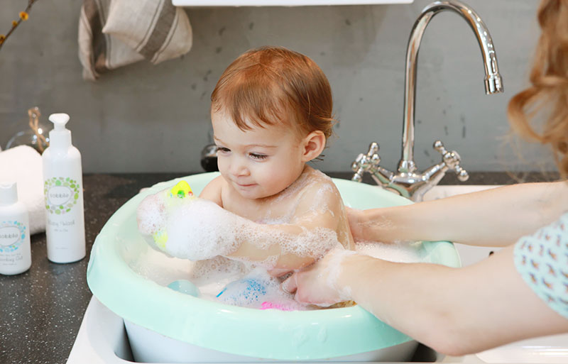 Baby in Cushioned Bath Tub